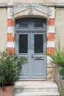 Atulam porte bois traditionnelle avec grille Laurie